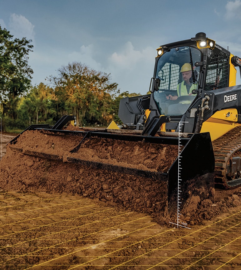 Equipamento de construção da Deere empurrando terra