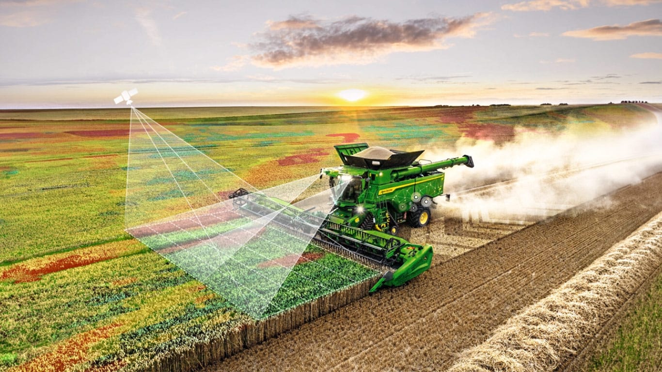 Colheitadeira John Deere no campo, demonstrando a conectividade da máquina