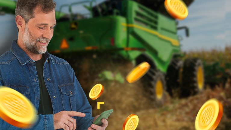 Homem usando celular com colheitadeira verde ao fundo e moedas douradas flutuando